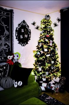 a decorated christmas tree in the corner of a living room with black and white decorations