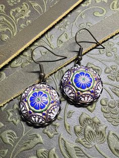 Vintage blue, gold, white and green mosaic cabochon set in a lace edge setting. Hung on a brass ox earring wires. Nickel free. Luxury Bohemian Cabochon Jewelry, Vintage Mosaic, Green Mosaic, Cabochon Earrings, Earring Wires, Earrings Bohemian, Lace Edging, Blue Gold, Unique Vintage