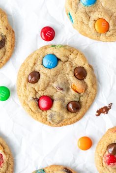 chocolate chip cookies with m & m candies on top and candy in the middle