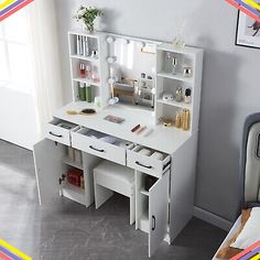 a white desk with drawers and shelves on it