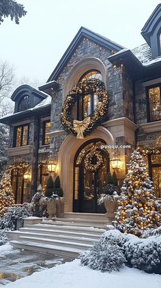 a large house decorated for christmas with wreaths and lights