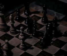 a black and white chess board with the pieces on it's sides facing each other