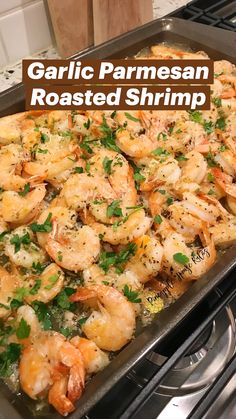 a pan filled with shrimp on top of a stove