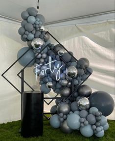 balloons are arranged in the shape of a pyramid and letters that spell out fairy on it