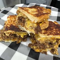 two grilled cheese sandwiches stacked on top of each other