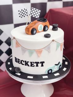 a birthday cake with a race car on top