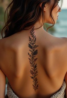 a woman with a tattoo on her back