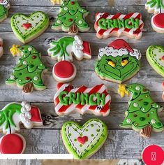 decorated cookies with the word grin on them and christmas trees in different colors, shapes and sizes