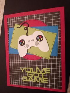 a close up of a card with a video game controller in the middle and words you've got game on it