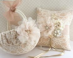 two wedding garters with flowers and pearls on them sitting next to each other