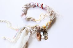 "Seashell Sprite" - cream and pastel dreadlock hair wrap Handcrafted with love and sunshine, these ethereal treasures entwine themselves into your hair like forgotten dreams. Picture it: salty sea breezes, sun-drenched sands, and the soft murmur of waves--this is where the journey begins. Yarns and fibers interlace with glistening crystals, their edges reflecting the sun's embrace. Small seashells, remnants of mermaid songs, whisper stories from faraway lands. These hair wraps are the beachy boh Whisper Stories, Boho Hair Wrap, Mermaid Song, Dreadlock Hair, Braiding Your Own Hair, Boho Hair, Dreadlock Extensions, Beachy Boho, Vegan Hair