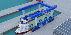 an aerial view of a boat being loaded onto a barge in the water with other boats nearby