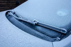 a car is covered in snow and ice