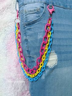 Rainbow Layered Pants Chain, Cute Wallet Chain, Rainbow Pride Color Plastic Chains, Kawaii Pocket Chains, Pansexual Flag Colors Layered pink, yellow and blue plastic chunky chain accessory. Super cute addition to your favorite outfit! A colorful way to express yourself. Based on the LGBTQIA+ flag colors. If you don't see your colors I would love to make them for you, just message me to start your order. See photos for size comparison with a ruler 📏 *Measurements based on length from clip to clip. The shortest chain is the one used for measuring as it's the best to determine how far it will reach on your body. The hanging layered chains are not measured, but you can see that they each get longer to create the stylish layered look.* I love using these chains as a pants chain or wallet chain Rainbow Belt Chain, Pink Yellow And Blue Outfit, Chains On Clothes, Pride Flag Outfit, Pansexual Outfit Ideas, Pride Accessories Diy, Pansexual Jewelry, Pansexual Pride Outfit, Pansexual Outfits