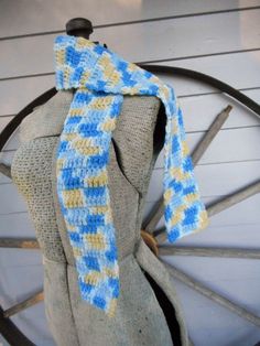 "Handcrocheted Boho \"The Neverending Storm: Mountain Top\" Scarf Colors are: Delft Blue, Cornflower Blue, Lemon & White Double crocheted for stretchiness & non sweating. This scarf is 48\" long x 4\" wide. We have a pair of matching gloves in the shop & also check out our Neverending Storm Necklace right this way: https://www.etsy.com/listing/467701504/the-neverending-storm-mountain-top?ga_search_query=blue&ref=shop_items_search_48 all our items come from a smoke & pet-free Blue Hand-knitted Yarn Patterns, Storm Mountain, Scarf Colors, Blue Cornflower, Scarf Neck, Delft Blue, Crochet Square, Mountain Top, Neck Wrap