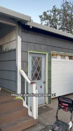 a house painted gray and white with the words house painting progress