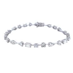 This 18k white gold diamond tennis bracelet is a classic piece of jewelry. Featuring 7.18 carats of mixed shape diamonds to add a touch of sparkle to your look, this bracelet is sure to be a timeless staple in your collection. DIAMOND 7.18 MIX TCW 24 PCS. F-G VVS1-VS218K WG 9.47 GRAMS SIZE 7'' BS-1698 White Diamond Bracelet With Baguette Cut, White Baguette Cut Diamond Bracelet Fine Jewelry, White Baguette Cut Diamond Bracelet, Rich Rich, Diamond Tennis Bracelet, Survival Prepping, Tennis Bracelet Diamond, Tennis Bracelet, White Gold Diamonds