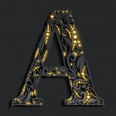 an illuminated letter on a black background