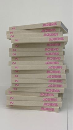 a stack of books sitting on top of each other in front of a white background