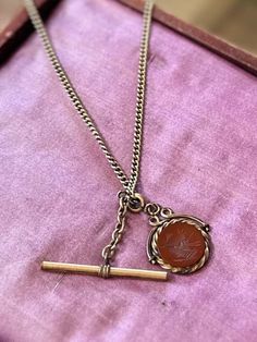 "Vintage Signed Automade Sterling Silver Gold Plated with Antique Carnelian Intaglio Soldier Pendant Necklace 24.5\" Victorian Fob Chain measures approximately 24.5 inches long and has a spring ring clasp. Clasp is marked \"AUTOMADE STERLING\". Intaglio measures approximately 1 inch wide by 1.1 inch long. \"Toggle\" bar measures approximately 1.6 inches long.  Pendant was added on and is older than the chain. Made out of gold filled metal and genuine carnelian. Necklace weighs approximately 20.1 Stamped Necklaces, Pet Jewelry, Antique Jewelry Necklace, Carnelian Necklace, Jewellery Necklaces, Family Jewellery, Neck Chain, Long Pendant Necklace, Charm Pendant Necklace