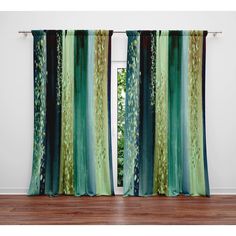 an open window with green and blue curtains