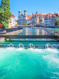 the water is blue and green in this city with many buildings on it's sides