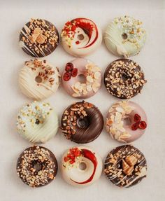 there are many donuts with different toppings on them