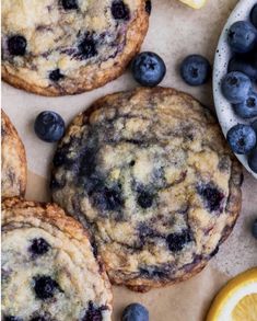 blueberry muffins and lemon slices on a table