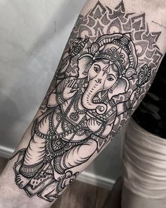 an elephant tattoo on the arm