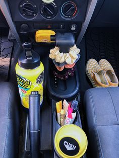 the interior of a car with various items in it