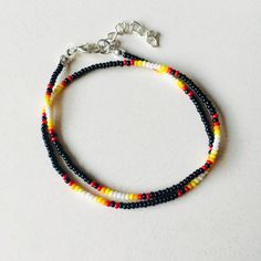 Here's a black dainty seed bead choker with a sunset gradient pattern. This simple colorful necklace is made from high-quality Czech seed beads and stainless steel accessories. It is lightweight and comfortable to wear and will be an eye-catching addition to everyday summer outfits as well as a beach look. If you are looking for beaded jewelry in Y2K, hippie, or bohemian style, or just need a delicate minimalist choker, this cute seed bead necklace is for you. 100% top-quality handmade beaded ne Trendy Black Beaded Bracelets With Tiny Beads, Black Beaded Bracelets For Summer With Round Beads, Multicolor Jewelry With Black Beads For Summer, Summer Multicolor Jewelry With Black Beads, Black Beaded Chain Jewelry For Summer, Black Jewelry With Colorful Beads For Summer, Summer Black Jewelry With Colorful Beads, Adjustable Black Choker With Colorful Beads, Adjustable Black Choker For Summer