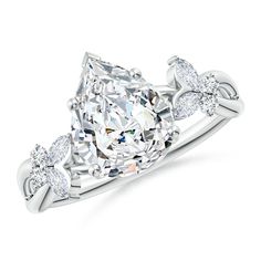 an oval cut diamond engagement ring with three pear shaped diamonds on the shoulders and sides