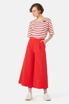 Our Chilli Culotte is designed to be a bright and bold closet essential with its vivacious red colour! Fitted comfortably at the high waist, this culotte is perfect for tucking a top into - complete with front slant pockets for ease of wear when you’re on the go! - Cotton and viscose blend fabrication - Full waistband - Button fly front, pleats and slant pockets - Back dart shaping - Standard fit - Cropped length, wide leg Style note: Style this culotte with our ‘Voulez Vous Oui Non Tee’ for a c Red Summer Pants With Side Pockets, Red Summer Pants With Pockets, Red Relaxed Fit Wide Leg Pants For Spring, Red Wide Leg Pants For Spring, Red Wide Leg Pants For Day Out, Red Wide Leg Pants Relaxed Fit For Spring, Red Wide-leg Pants For Day Out, Red Cotton Bottoms With Side Pockets, Red Cotton Pants With Side Pockets