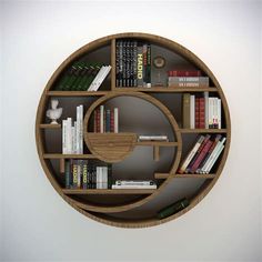 a circular wooden shelf with books and other items on it in the shape of a circle