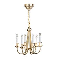 a gold chandelier with six candles hanging from it