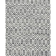 a black and white rug with an intricate design