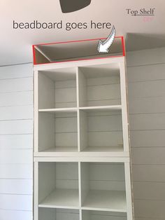 the top shelf is painted white and has red trim on it, with an arrow pointing to