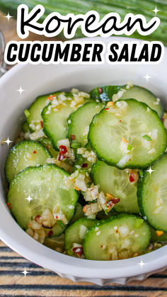 a white bowl filled with cucumber salad on top of a wooden table