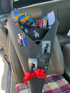 the back seat of a car is decorated with pictures and cards