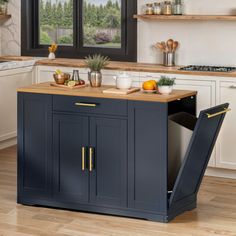 a kitchen island with an open door on the side in front of a stove top oven