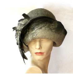 Millinery unique hat,Felt hat, cloche hat, Felted Hat, Women hat, Cloche hats, felt hats, felt cloche, Retro hat La belle epoque, Art Deco, 1920s hat Art Hats, Grey ,White , hat cloche Formal hat, Felt formal hat Wool Merino wool Beautiful HAT ! Great shape, beautiful color - shades of grey. The hat is made from the highest quality materials (100% Australian merinowool). Soft, pleasant to the touch. Very flattering ! Special and unique ! Sophisticated and elegant ! As the base for my works I use Gray Winter Cloche Hat With Curved Brim, Fitted Cloche Winter Hat, Gray Felt Hat For Winter, Gray Fitted Felt Hat For Winter, Winter Fitted Cloche Hat, Winter Felt Brimmed Cloche Hat, Winter Felt Cloche Hat With Short Brim, Winter Felt Cloche Hat With Brim, Winter Mini Hats With Short Brim In Felt