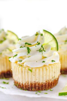 small cupcakes with lime and whipped cream on top