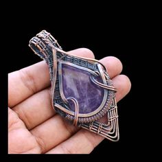 Welcome to our little shop, where you can find handmade copper wire jewelry and more, for you and your loved ones. We do accept custom orders also, kindly message us for more. Purple Amethyst Wire Wrapped Pendant Handmade Pendant Amethyst Pendant Gemstone Copper Wire Wrapped Jewellery Gemstone Pendant Gift For Her Main Stone - Amethyst Metal - Copper Pendant Length - 8.75 CM Pendant Width -  4.75 CM * Protection:- Copper will be tarnished after a while so try to limit contact with lotions, soaps Artisan Amethyst Wire Wrapped Jewelry, Handmade Purple Copper Wire Necklace, Artisan Purple Wire Wrapped Jewelry, Handmade Purple Necklace With Copper Wire, Handmade Artisan Purple Jewelry, Purple Wire Wrapped Metal Jewelry, Nickel-free Copper Wire Jewelry For Crafting, Adjustable Purple Copper Wire Jewelry, Purple Gemstone Copper Jewelry