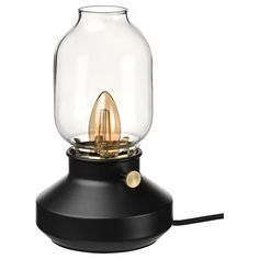 a black table lamp with a glass dome on top