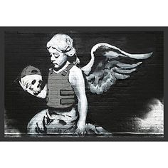 a black and white photo of an angel holding a skull