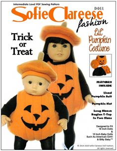 the doll is wearing a pumpkin costume