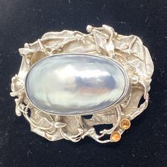 Beautiful Rare Antique Oval Brooch With Mother Of Pearl And 2 Amber Studs Set In 925 Sterling Silver Frame Excellent Condition Luxury Silver Oval Brooches, Elegant Sterling Silver Brooch With Cabochon, Unique Silver Brooches For Evening, Sterling Silver Brooch, Stud Set, Amber Color, Silver Brooch, Silver Frame, Rare Antique