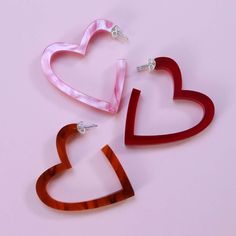 New for 2024! Simple statement heart shaped hoop earrings laser-cut from tortoiseshell, red and pink marble acrylic. The perfect gift for your bestfriend / girlfiend. Say it with earrings! Lightweight and easy to wear the Heart Hoop Earrings make the perfect addition your V day look or an ideal gift for your love / pal. The minimal design lends these eye-catching hoop earrings maximum versatility. For Valentines Day and beyond.  The hoops are made from lovely lightweight perspex so can easily be Gifts For Your Bestfriend, Shaped Hoop Earrings, Modern Hoop Earrings, Heart Hoop Earrings, V Day, For Your Love, Beautiful Colours, Pink Marble, Valentine Heart