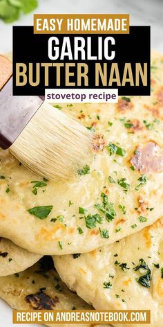 garlic butter naan recipe on a plate with a spatula being used to make it