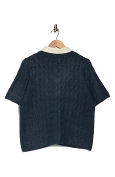 This cable-stitched sweater is contrasted by a woven collar in this twofer top that elevates in-office or off-duty looks. 19 1/2" length Point collar Short sleeves 73% acrylic, 24% polyester, 3% spandex Machine wash, tumble dry Imported Workwear Polo Sweater With Ribbed Collar And Crew Neck, Casual Tops With Contrast Collar For Fall, Spring Sweater With Collar For Work, Collared Knit Sweater For Layering, Blue Sweater With Ribbed Collar For Work, Spring Workwear Sweater With Collar, Casual Cable Knit Polo Sweater For Work, Casual Cable Knit Tops For Work, Workwear Sweater With Ribbed Collar